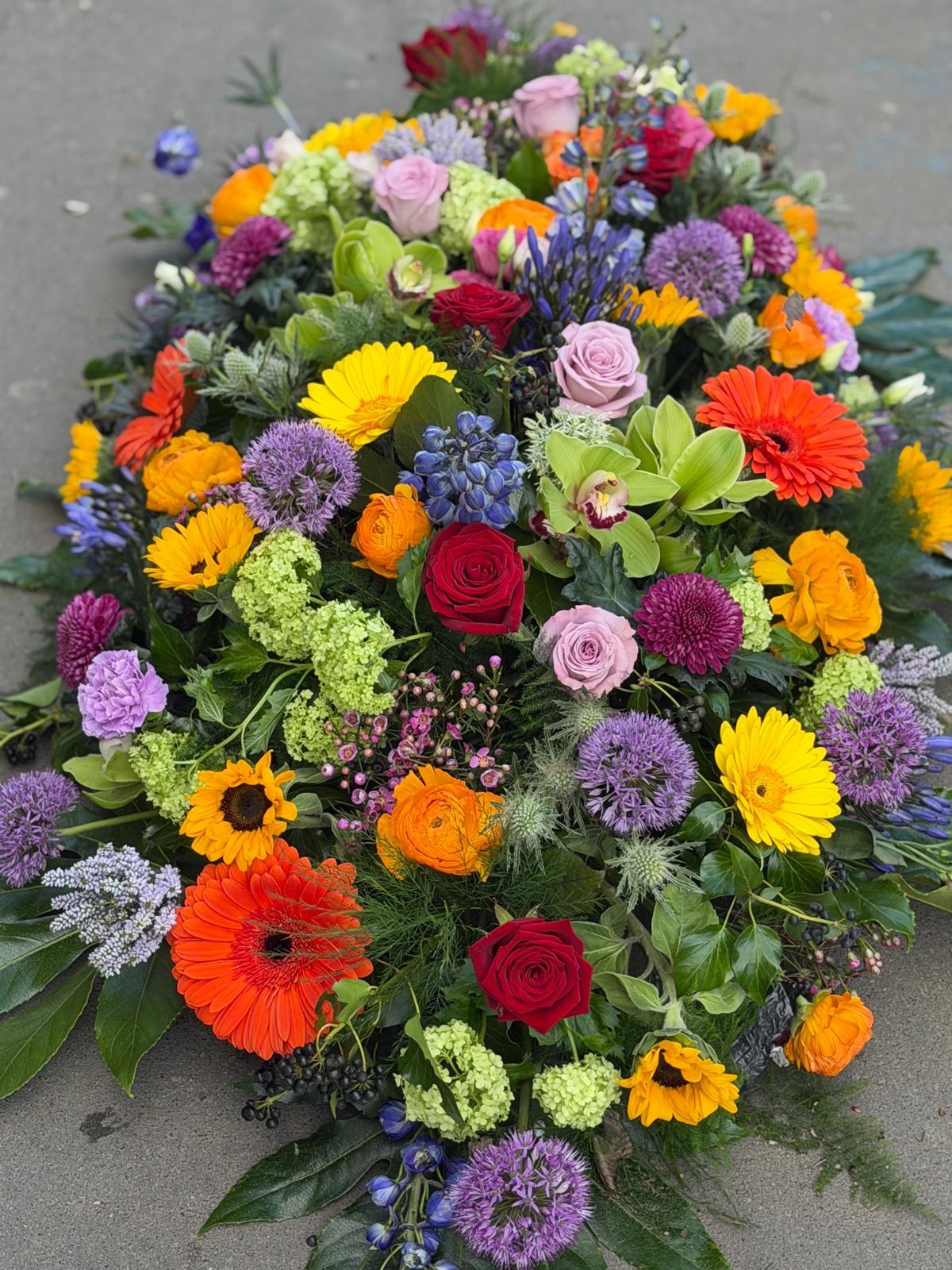 Dotties Signature Rainbow Casket Spray